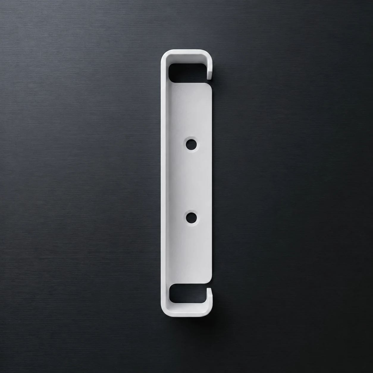 White Whitnall BoardClip concealed deck skirting fixing bracket on a charcoal surface